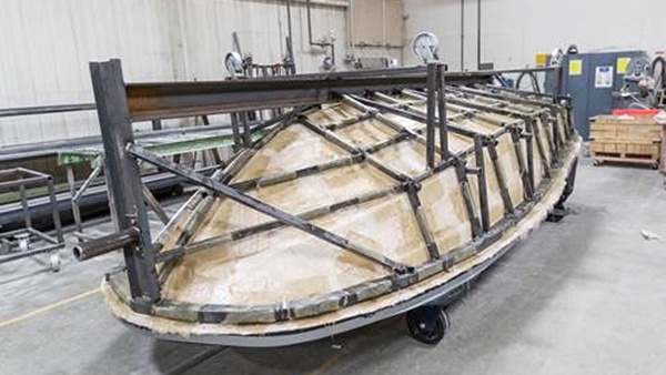 Finished frame on boat hull pattern after casting the fiberglass mold Finished frame on boat hull pattern after casting the fiberglass mold