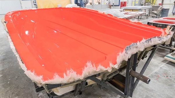 Finished boat hull mold in red Finished boat hull mold in red
